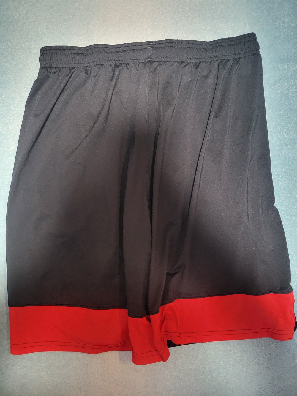 Under Armour Men’s Black Shorts with Red Hem and Blue Flag - Picture 4 of 5